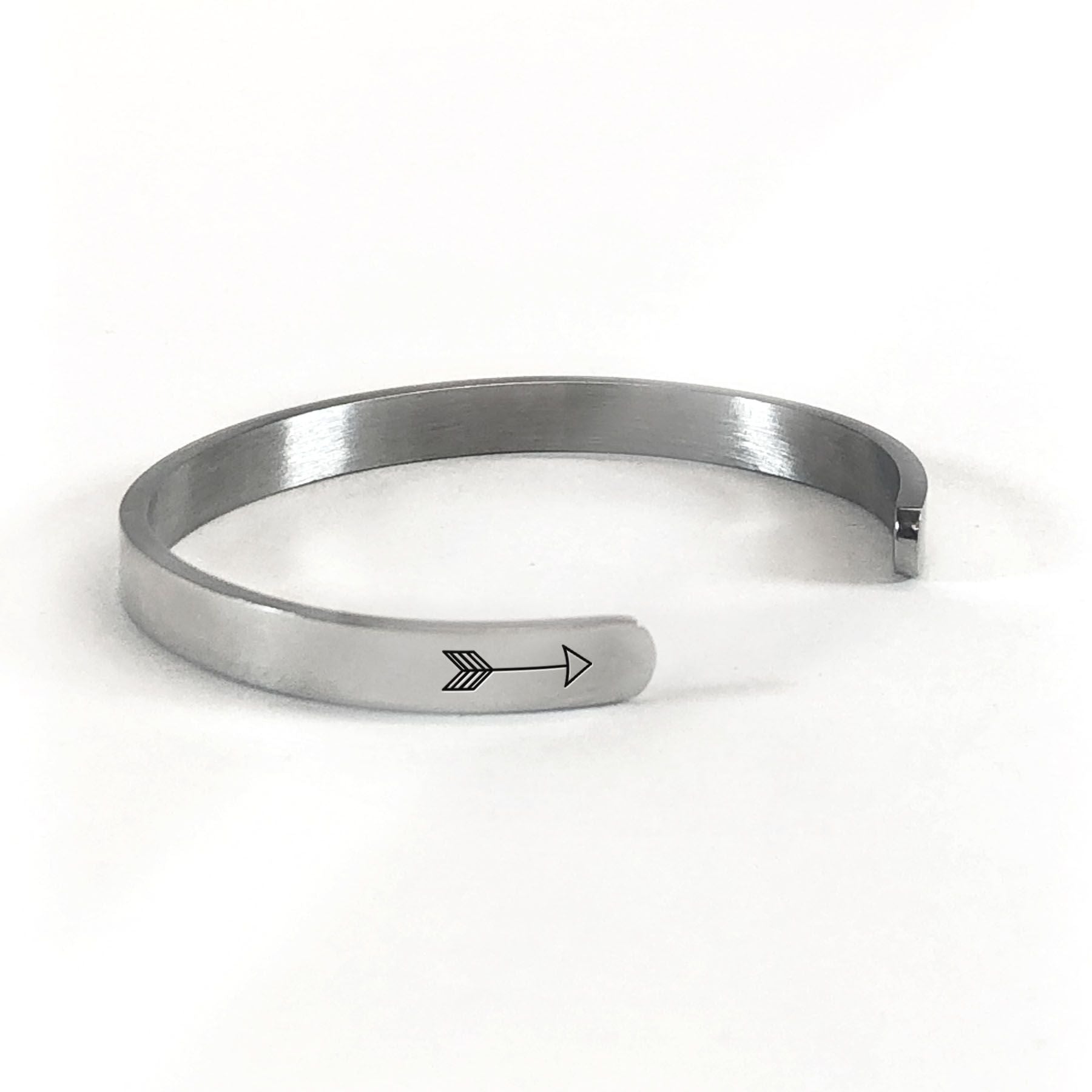 Live what you love bracelet in silver rotated to show arrows and cuff opening