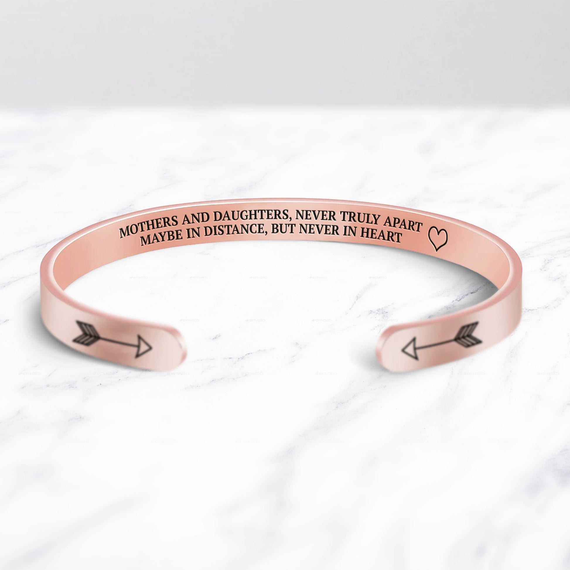 Mothers and Daughters Never Truly Part Cuff Bracelet bracelet with rose gold plating on a marble background