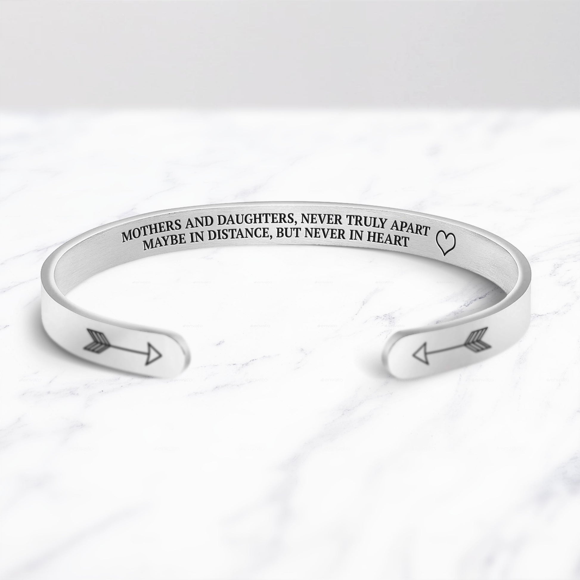 Mothers and Daughters Never Truly Part Cuff Bracelet bracelet with silver plating on a marble background